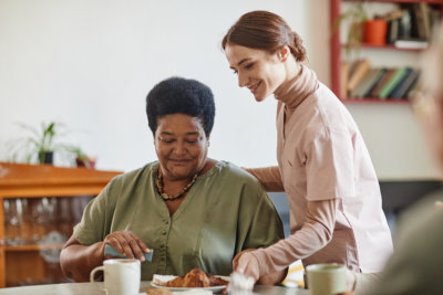 caregiver assisting a old woman