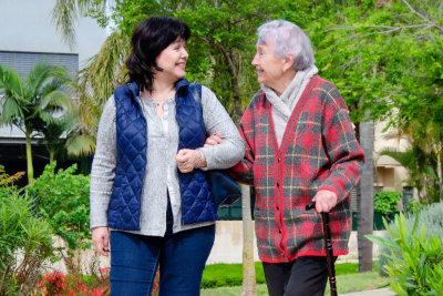 caregiver assisting a woman