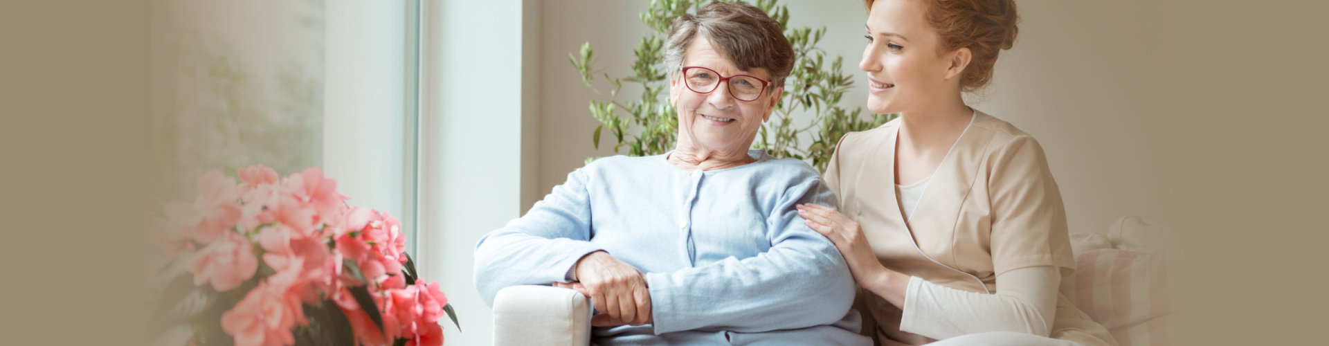 caregiver smiling to a senior woman