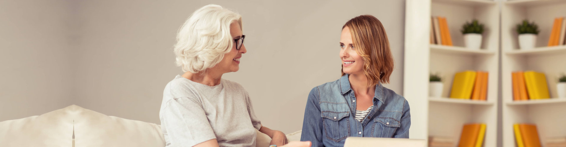 caregiver and a senior woman having conversation